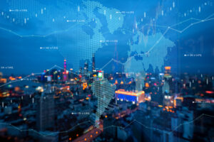 Decorative image of the world map overlaying an image of a skyline at night.
