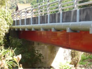 The red underside of a bridge.