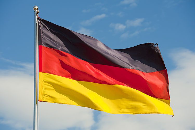 German flag against blue sky