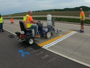 paint being applied on concrete for a transverse test