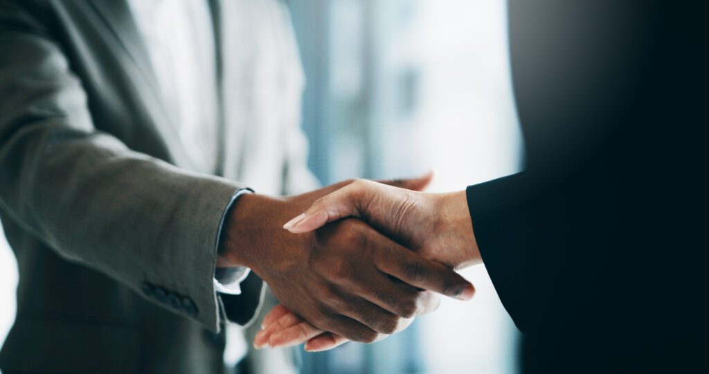 Closeup shot of two unrecognisable businesspeople shaking hands