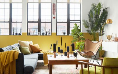 room with yellow walls and big windows